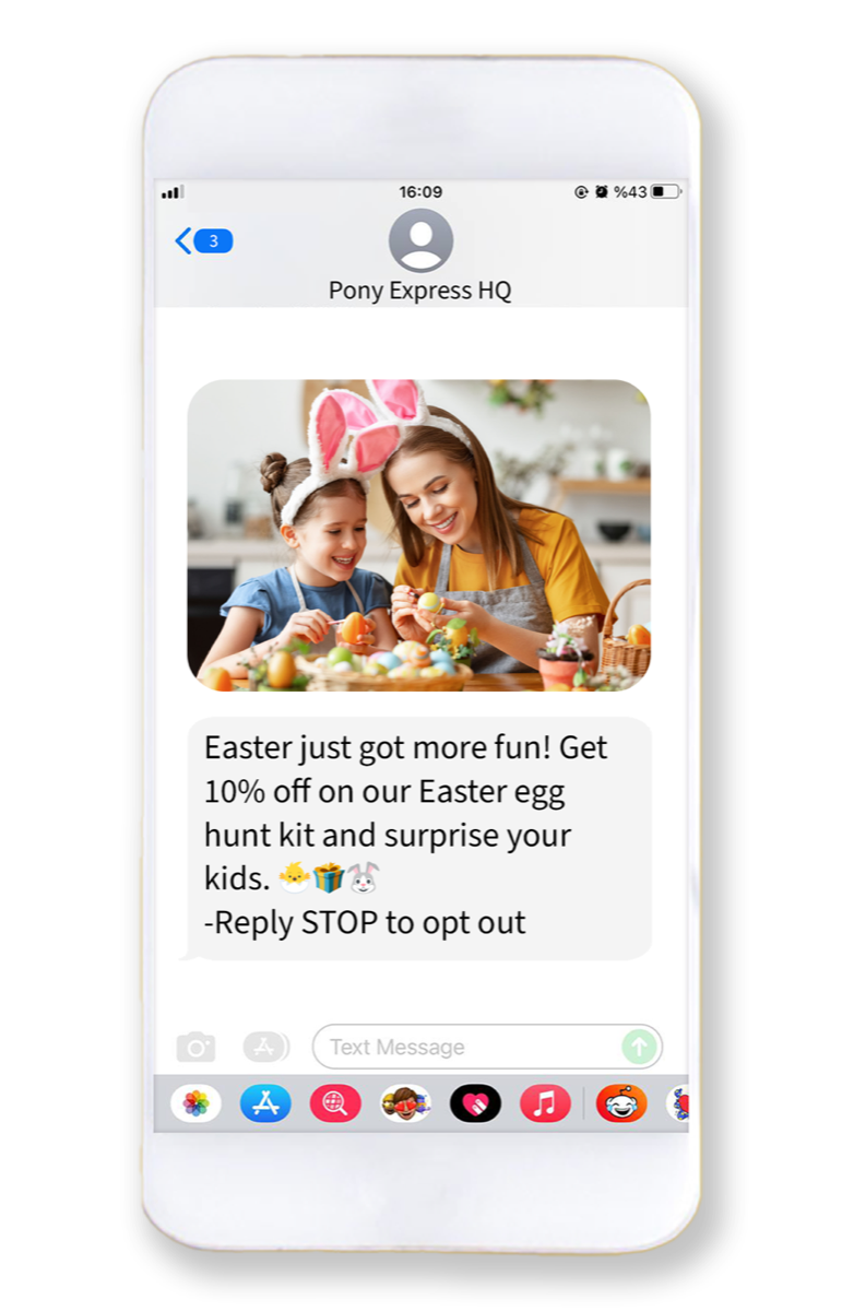 Phone showing an MMS from a toy store: a photo of a mother and child in bunny ears painting Easter eggs